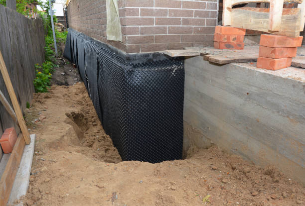 Happy homeowners after waterproofing job in Berkey